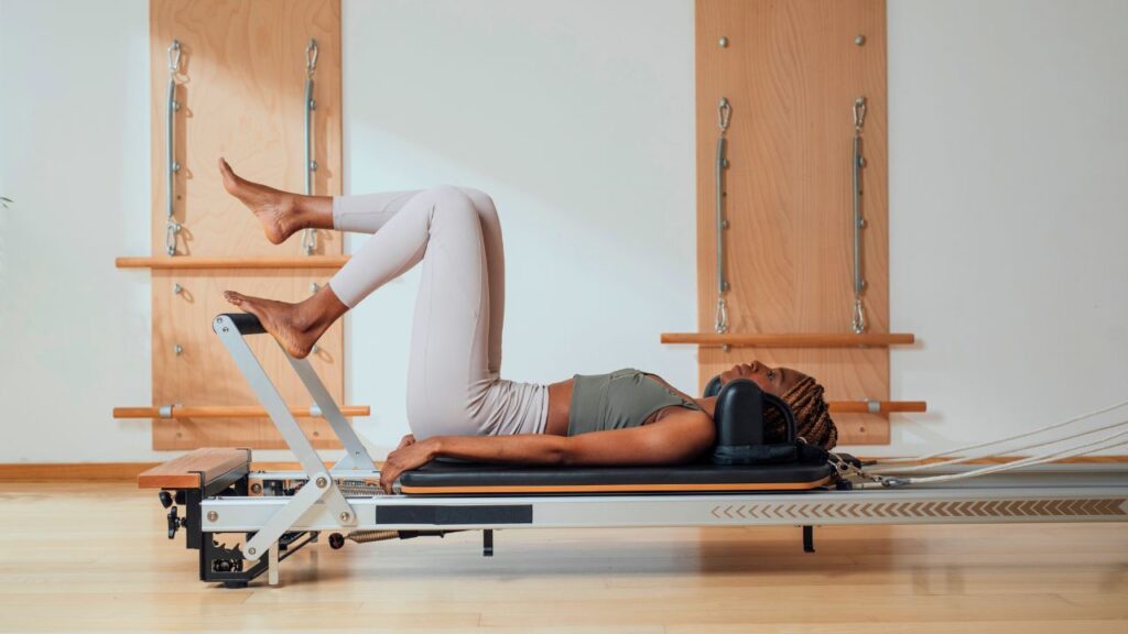 Single leg footwork on Pilates Reformer.